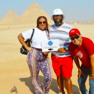 Travelers at giza pyramids complex