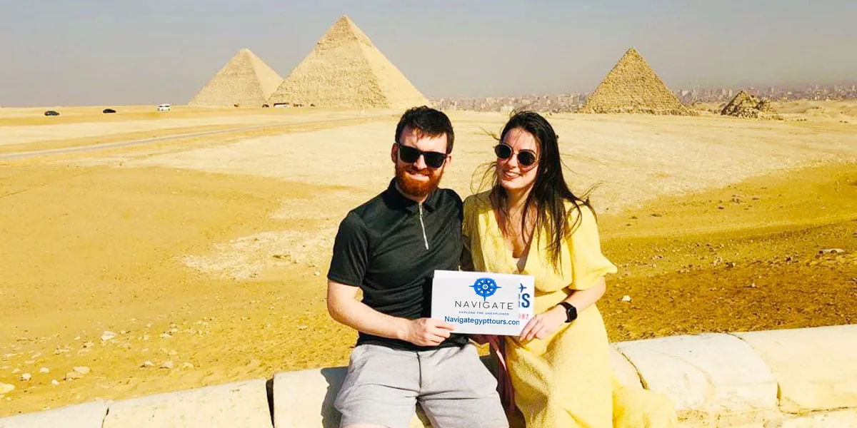 Travelers at giza pyramids plateau