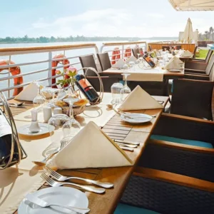 Nile cruise dining deck with Navigate Egypt Tours branding